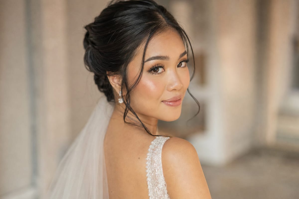 A bride's finished bridal hair and makeup, glowing in soft Bali light